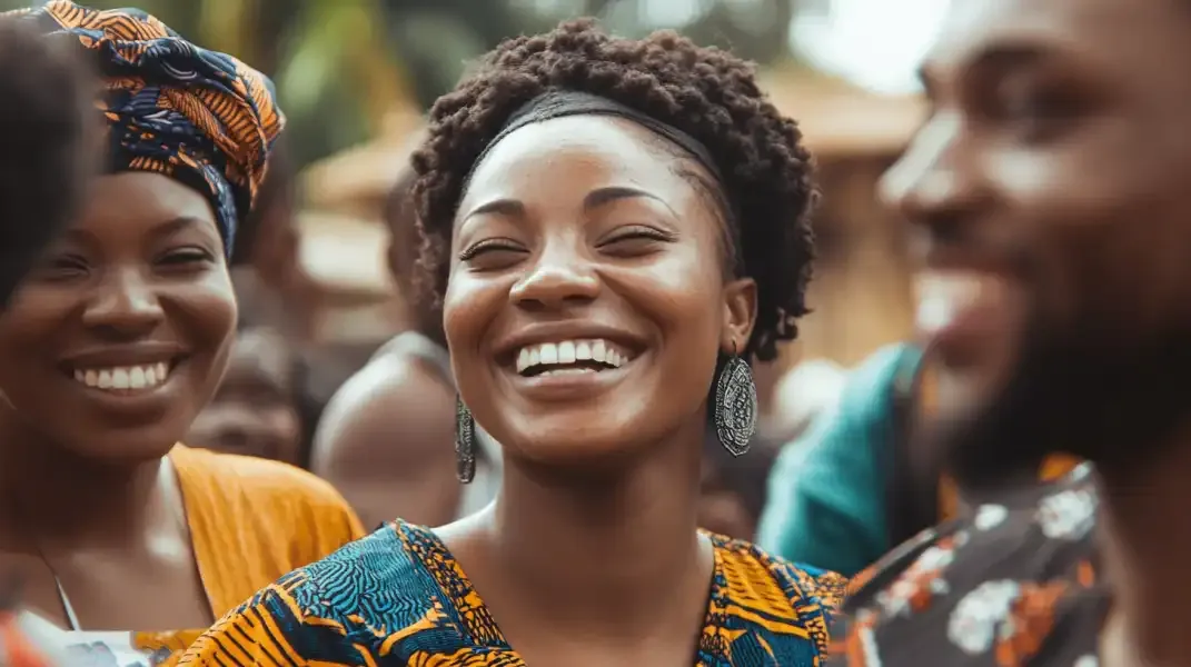Friends laughing and enjoying time together in Benin, reflecting joy and generosity through digital gift cards.