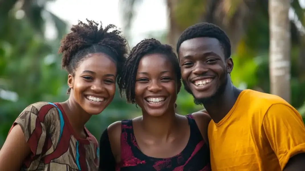 Three happy friends outdoors in Ivory Coast, enjoying time together with vibrant energy.