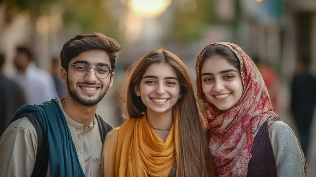 Three smiling friends in Pakistan enjoying time together, representing the joy of sharing digital gift cards.